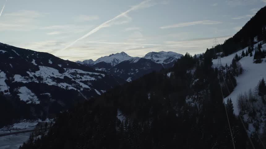 Power cables run across the top of the mountains