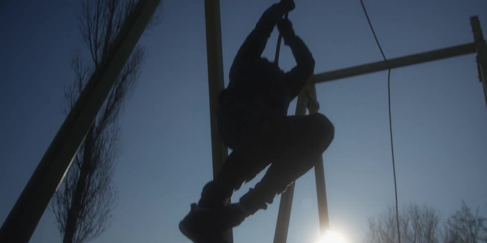 Person climbs a cable