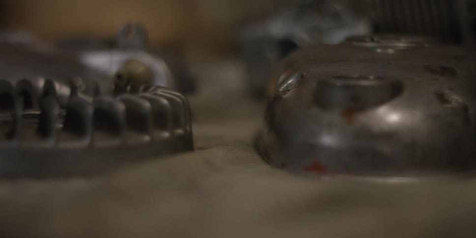 Blurred metal parts on a flat surface