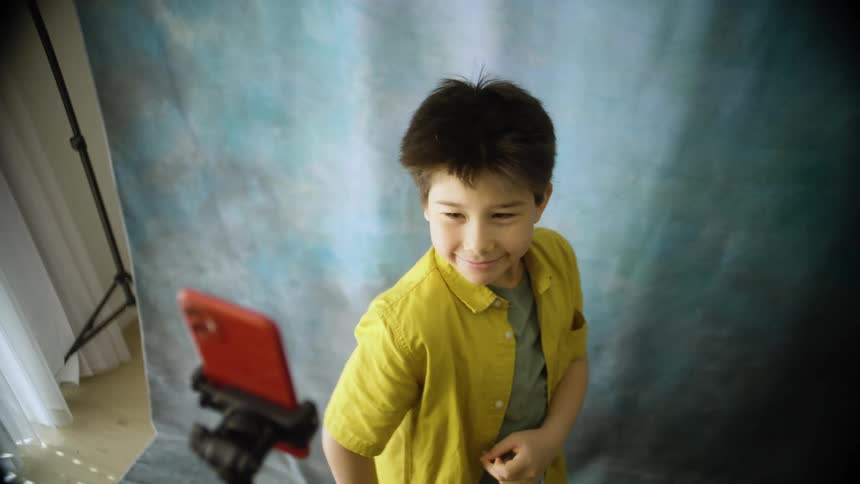 A child cheering and jumping