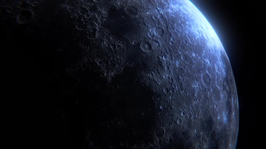Partially illuminated lunar surface with visible craters
