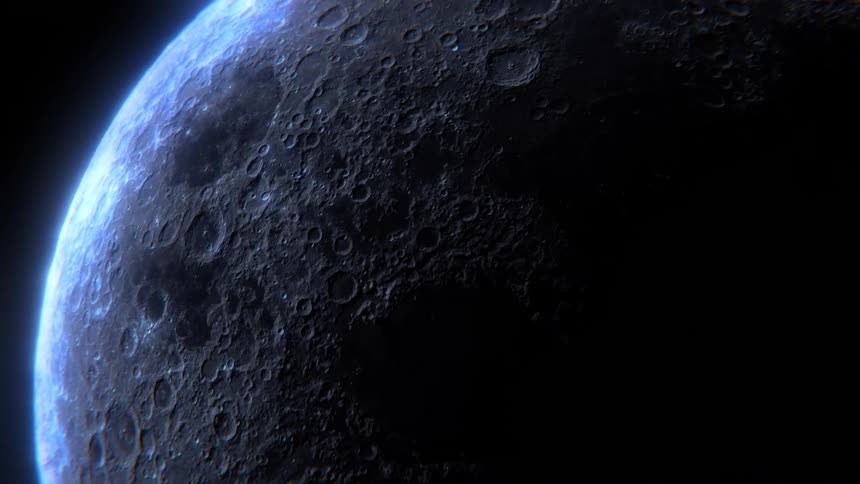 Close up of the moon with visible craters reflecting light in the night sky
