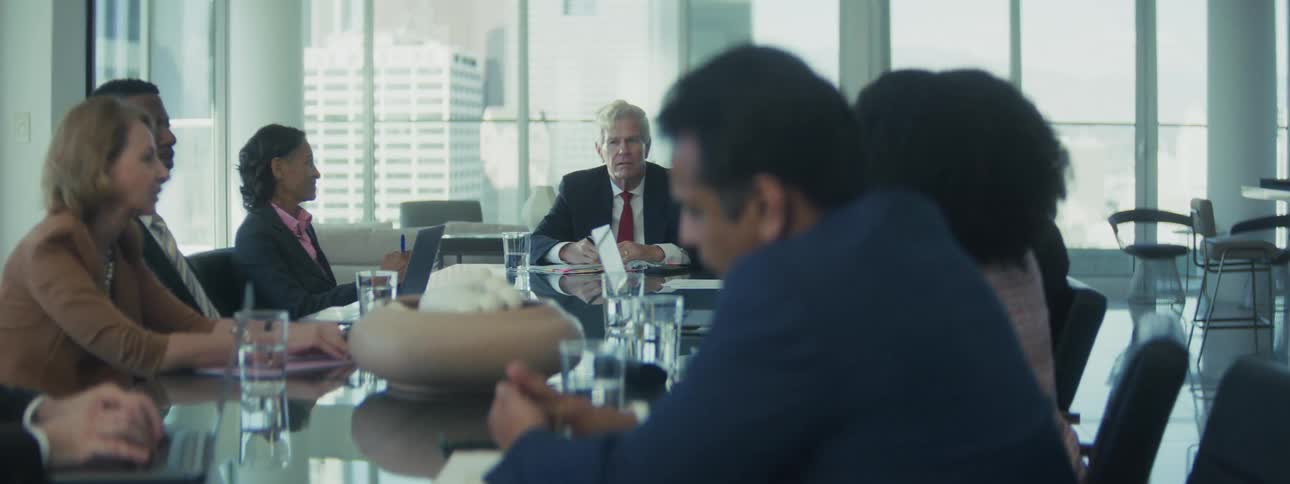 A group of people working together in a boardroom