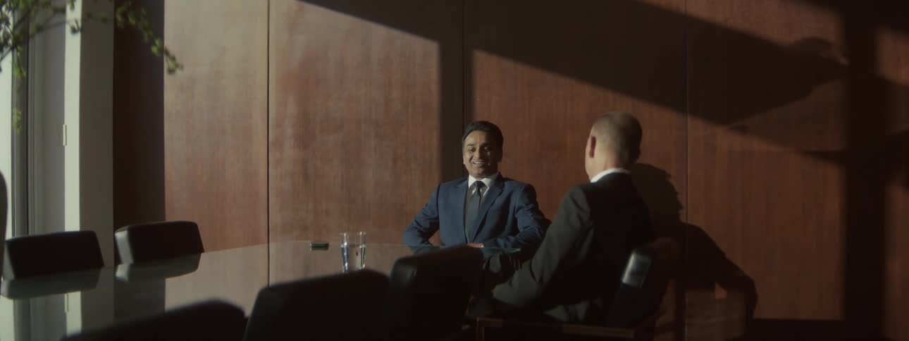 Two people talking in a room
