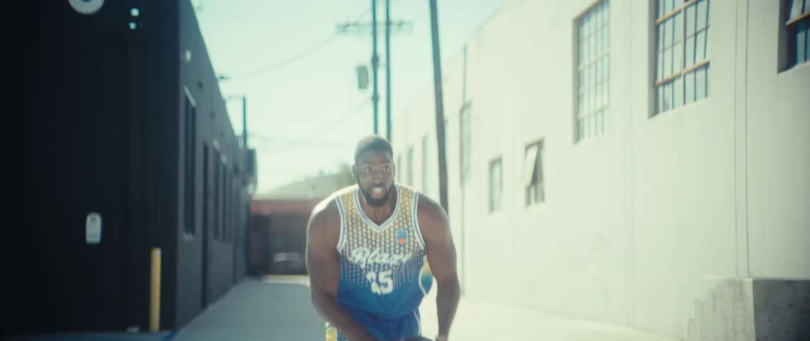 Man misses target while throwing a basketball