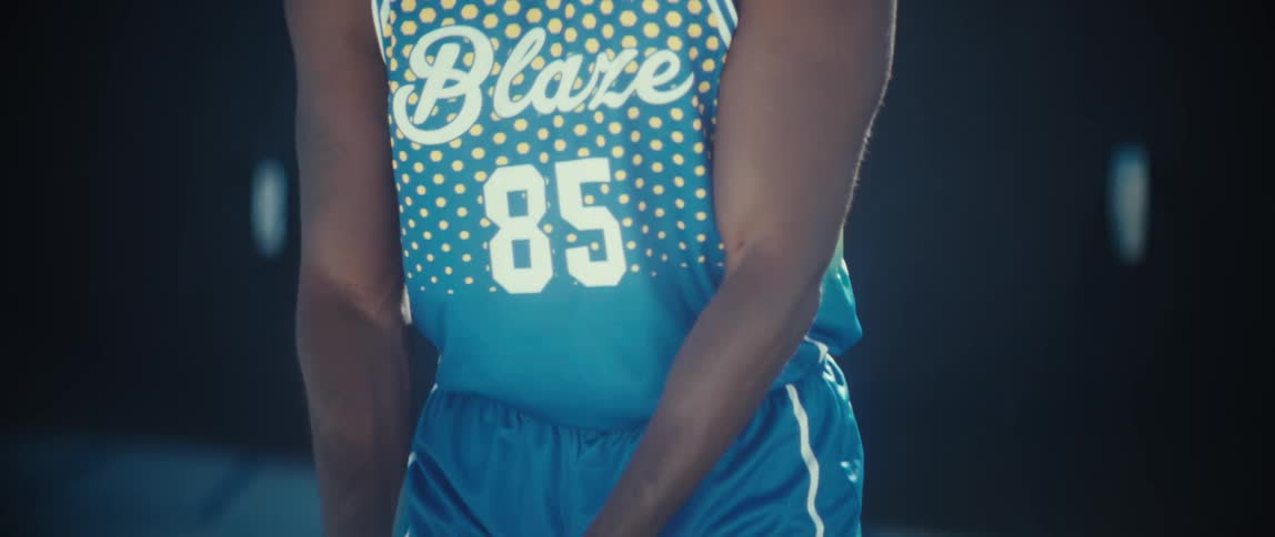 A man bouncing a basketball
