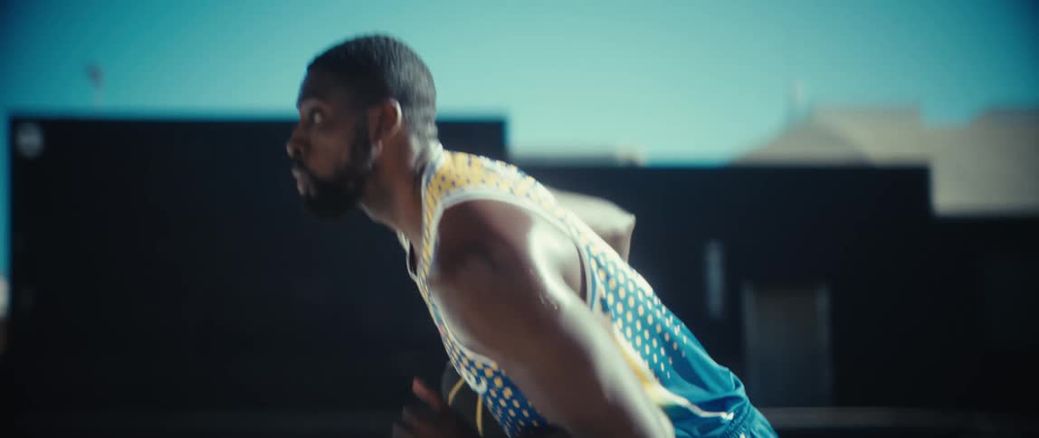 Man playing basketball outdoors