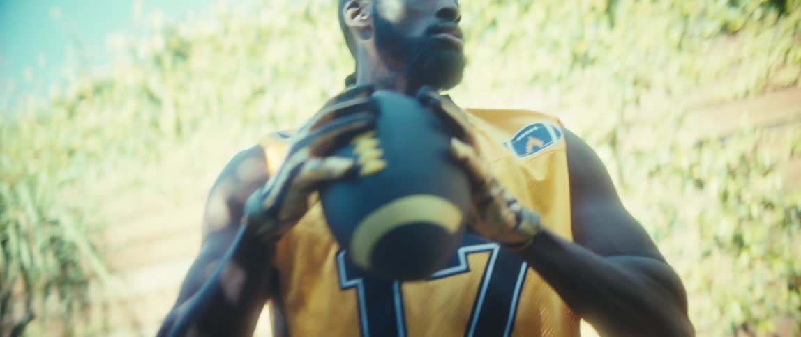 The man throws the football outside