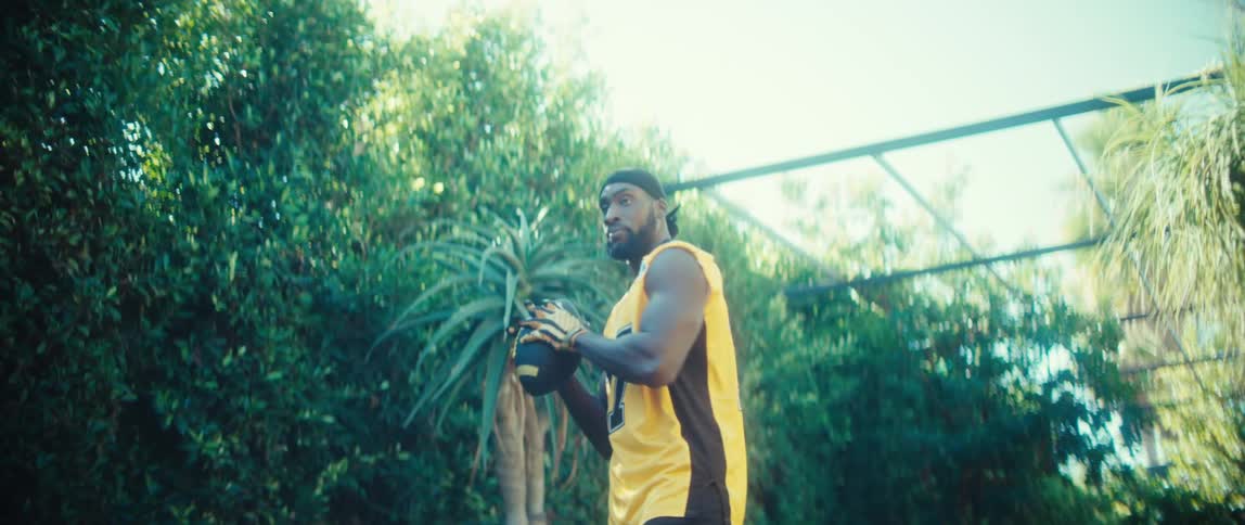 A man catching a football outdoors