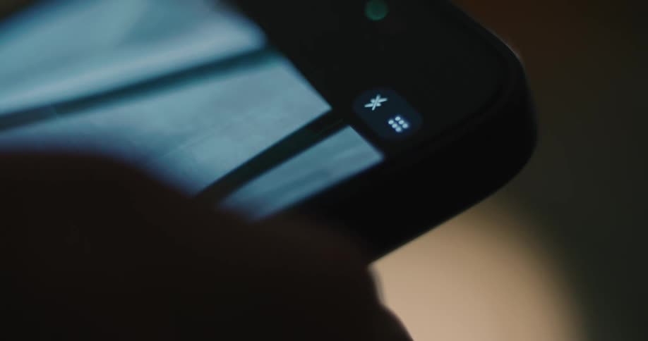 A person using a smartphone in a room