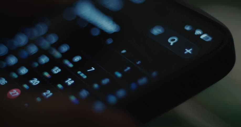 A person touching a button on a smartphone screen