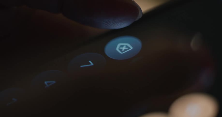 A person uses the calculator feature on their smartphone punching in numbers