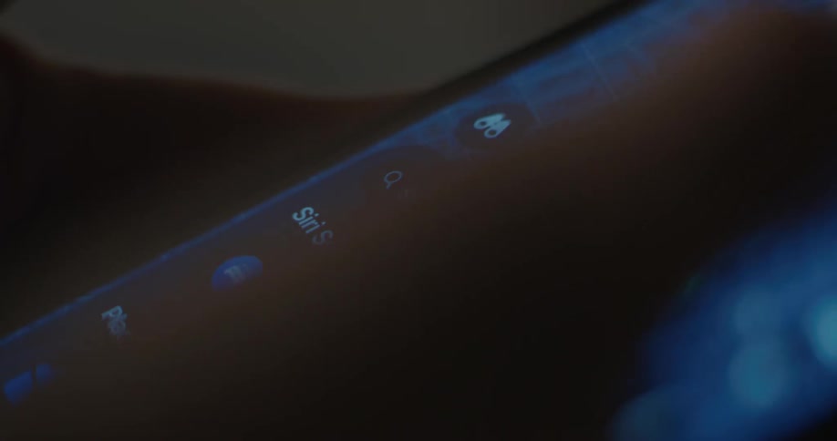 Smartphone screen displays a contact list with a dark interface and blurred text in the foreground