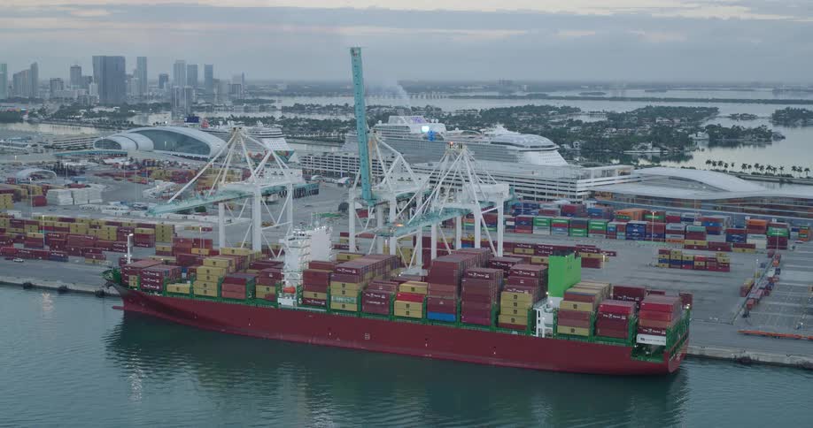 Cargo ship filled with containers at the loading dock