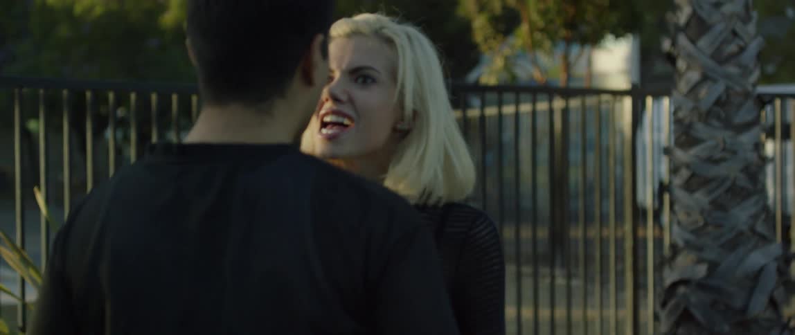 A woman and a man argue outside