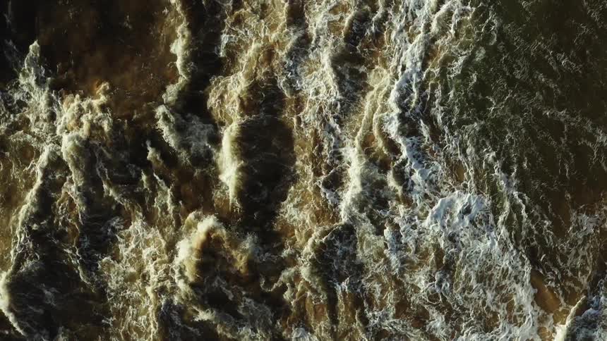 Waves breaking at the ocean outdoors during dusk or dawn