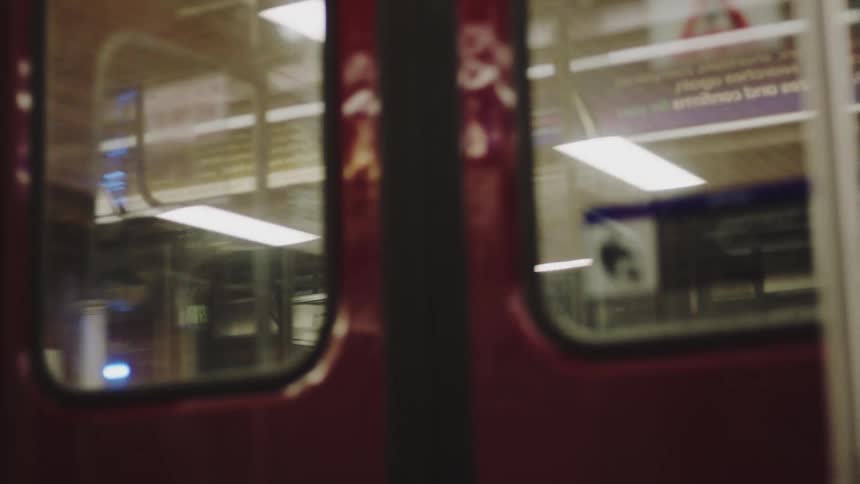 A view from a train pulling up to a station
