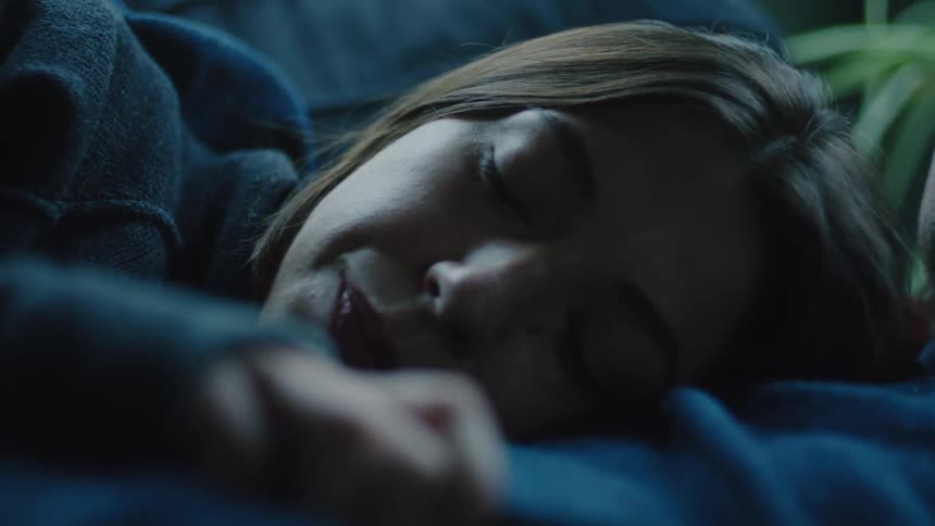 Woman lying down lost in thought