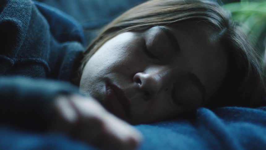 Woman lying on the chest of a sleeping man
