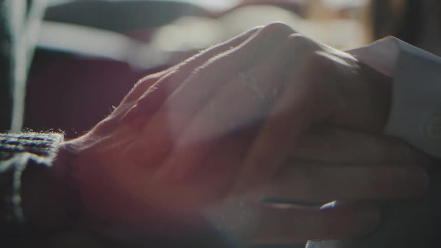A man and woman holding hands