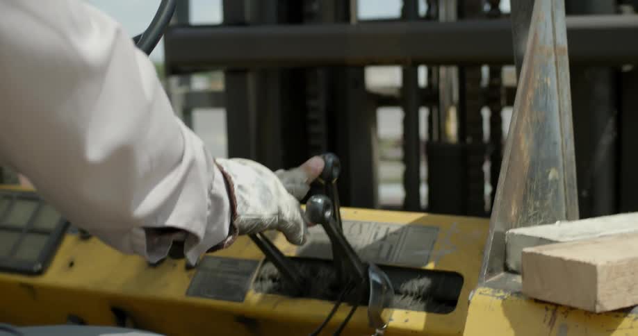 A man operates a forklift