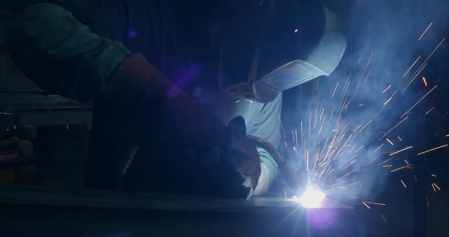 A welder using a flame torch