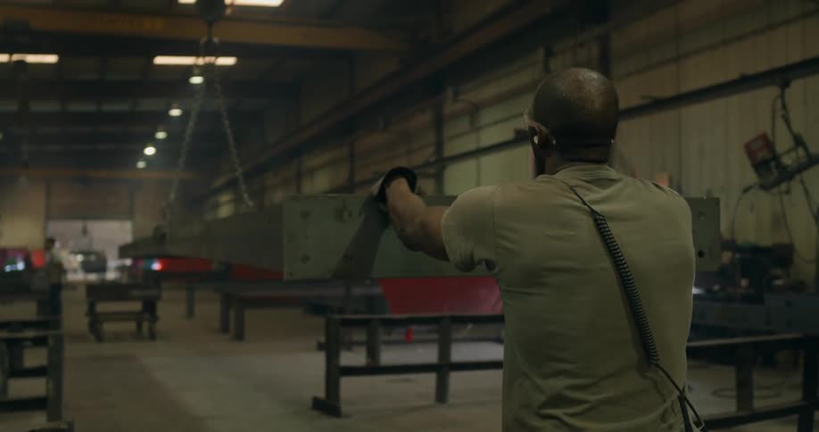 A man works in a factory setting