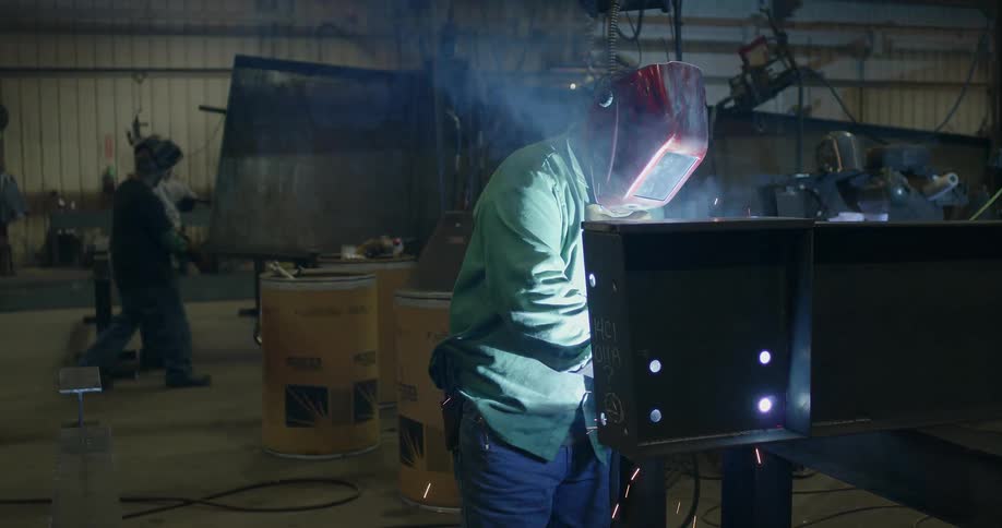 Welders working in a workshop