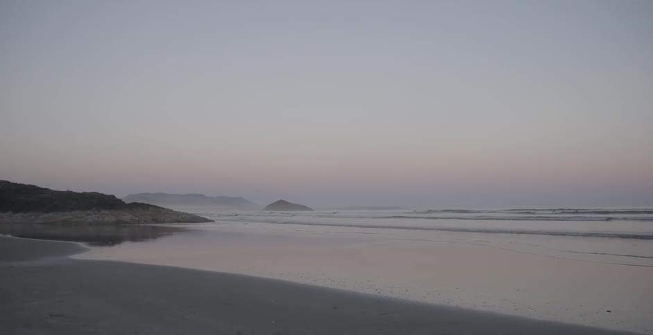 Waves come to shore at the beach