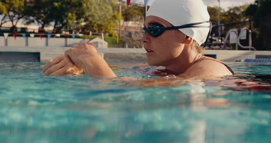 A woman that is swimming in a pool