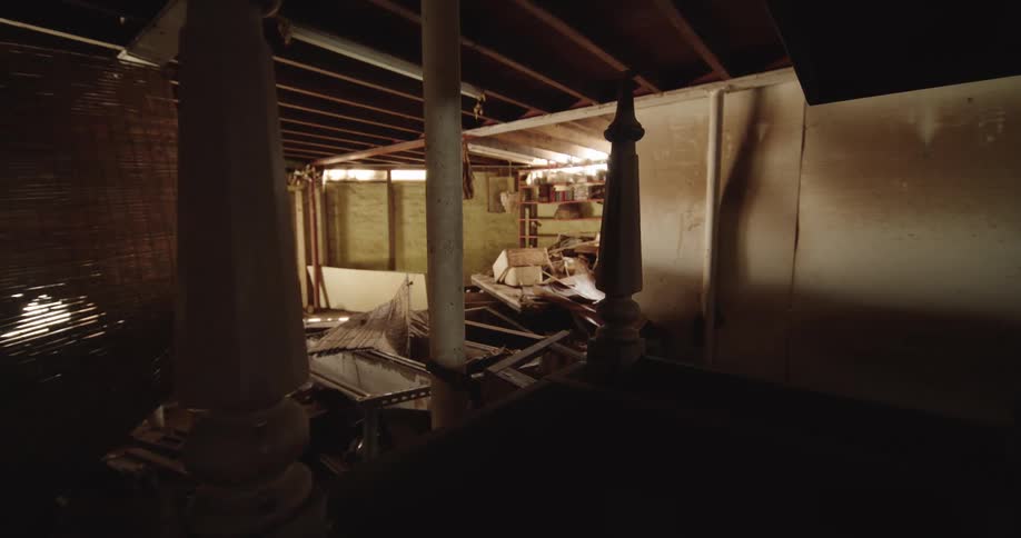 Stacks of wood are all over the basement floor