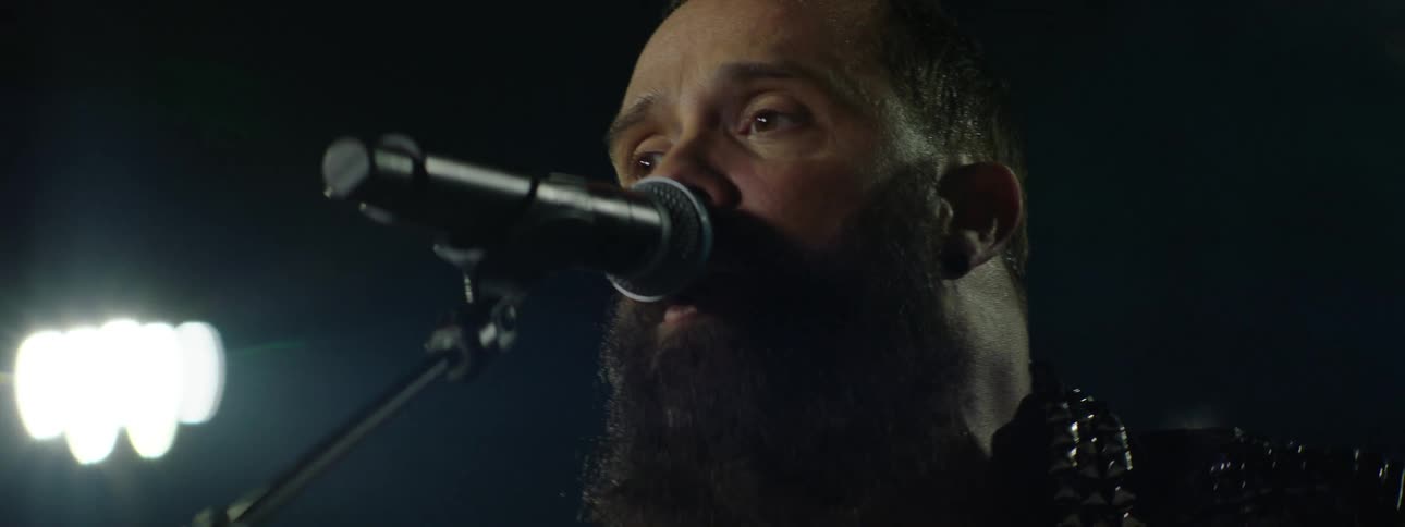 A man singing into a microphone