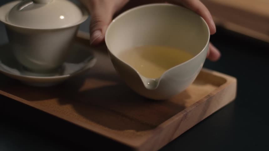 A person holding a cup of tea