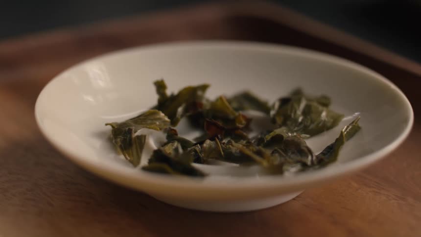 The plate is full of green tea leaves