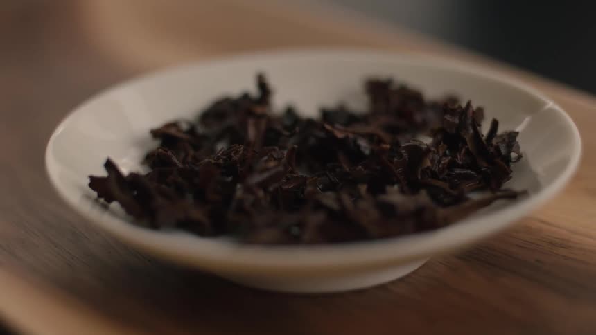 Tea leaves are on the small plate