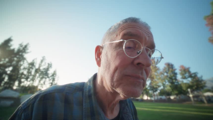A man using a tablet outdoors