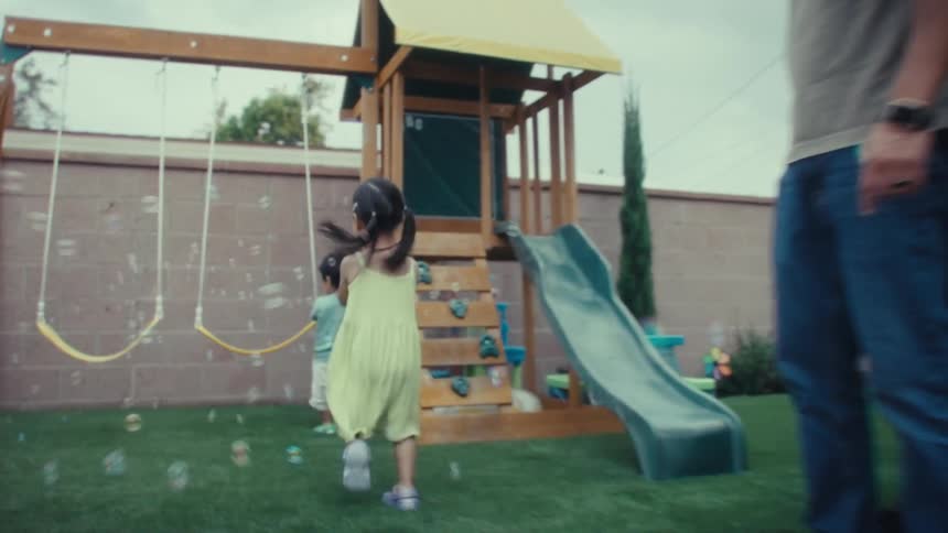 The children bubbles through the yard while running