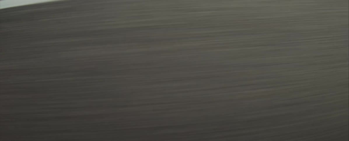 Blue strip with white line on racetrack seen in motion