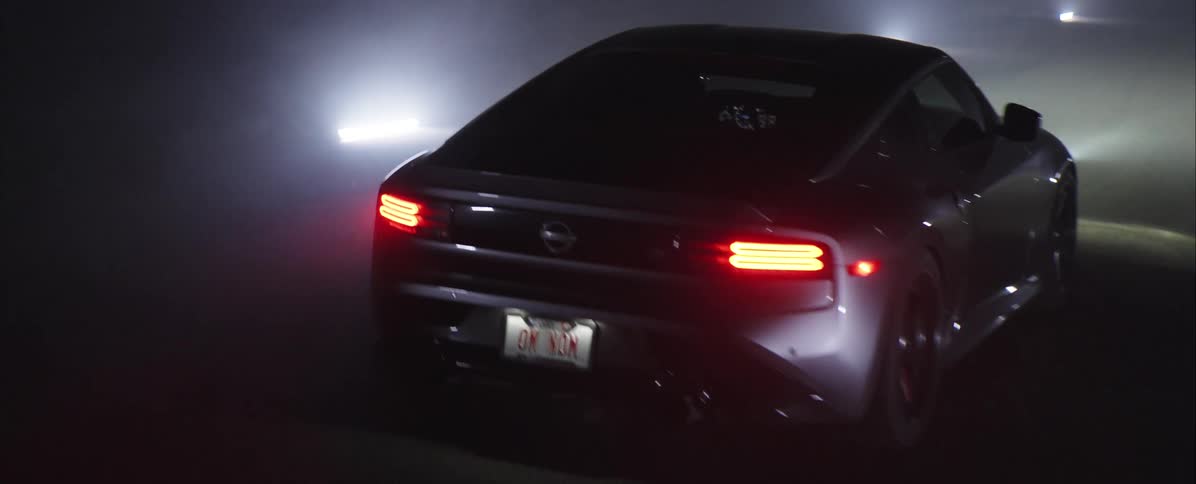 A car outside on a misty night