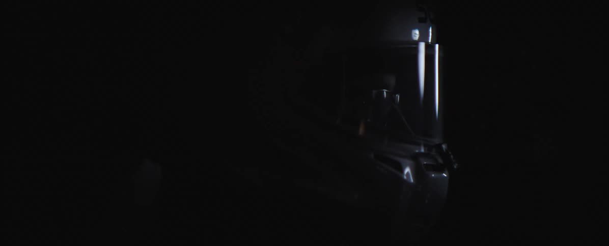 A close up profile shot of a motorcycle helmet as a person rides at night