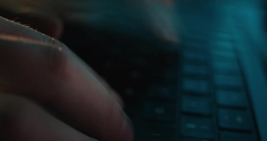 A person typing on a keyboard