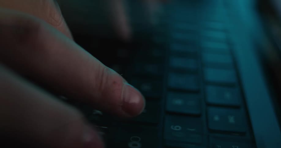 A person typing on a keyboard