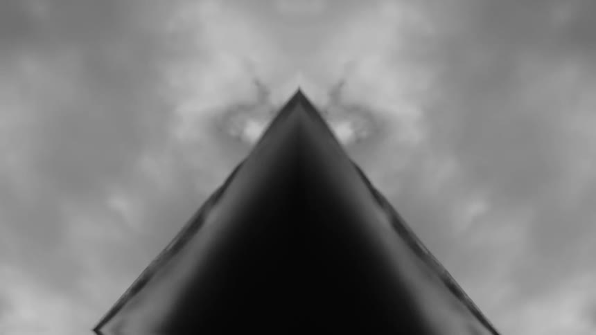 An abstract view of a black triangle and clouds
