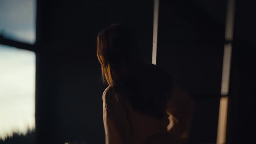 A woman walking around in a room