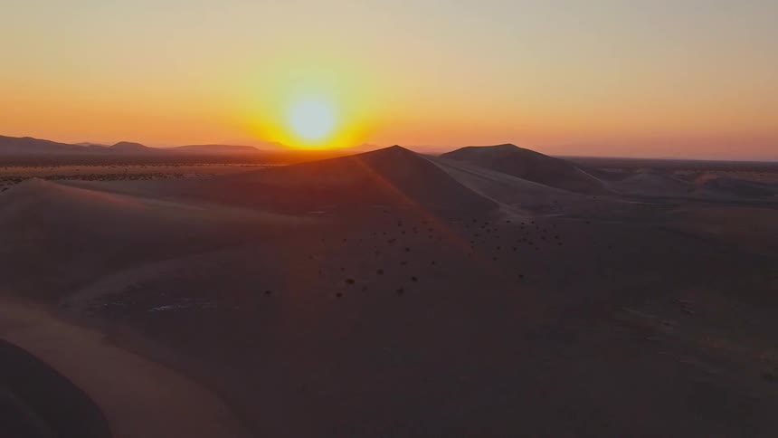 Aerial of a desert landscape at sunset