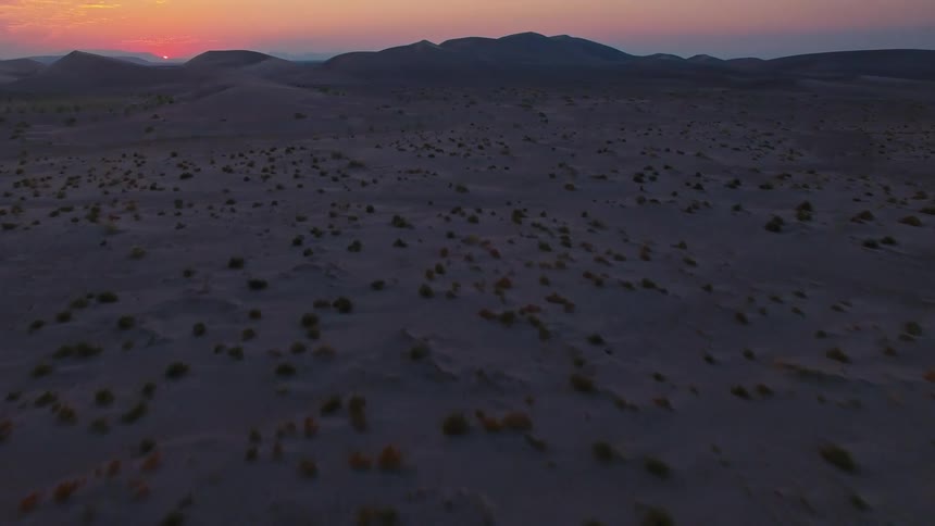 Aerial of a desert landscape at sunset