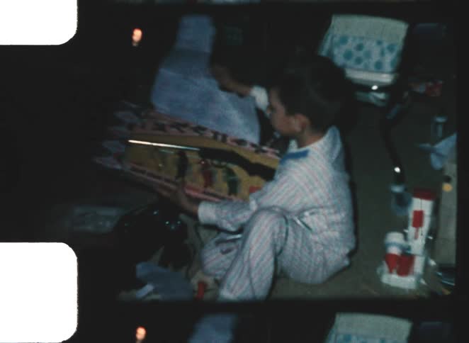 A child opening presents