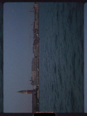 Ocean flows past the waterfront in the evening in a rotated landscape