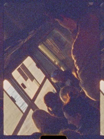 Passengers seated inside a boat as sunlight comes through the windows