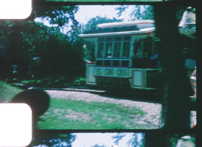A group of people riding a small train